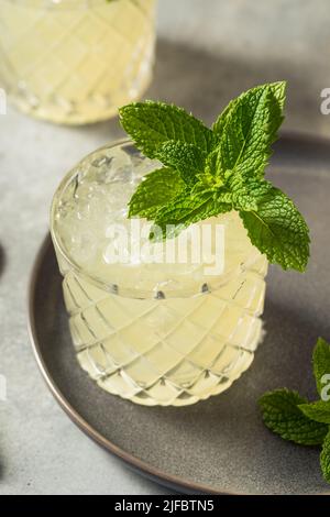 Cold Boozy Refreshing Whiskey Smash Cocktail with Mint Stock Photo