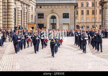 A military marching band at the changing of the guard in the Royal Palace (Kungliga Slottet) in Stockholm, Sweden Stock Photo