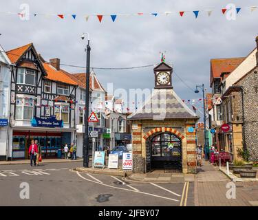 Sheringham, UK - May 16th 2022: Clock tower in the seaside town of Sheringham in Norfolk, UK. The construction was originally a water pump which suppl Stock Photo