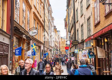 Shoppers and tourists filling Västerlånggatan (the Western Long Street)  in Gamla Stan (the old town) in Stockholm, Sweden Stock Photo