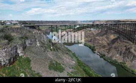 A view of a river and bridge between the canyons Stock Photo