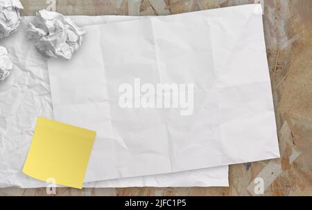 blank crumpled sticky note paper on texture paper as concept Stock Photo
