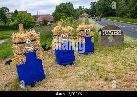 Nawton, UK - June 5th 2022: Bales of Hay dressed as Minions, as you enter the village of Nawton in North Yorkshire, UK. The creations were entrants in Stock Photo