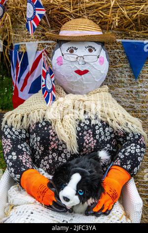 Nawton, UK - June 5th 2022: Farmers Wife Scarecrow in the village of Nawton in North Yorkshire, UK. The creation was an entrant into the Nawton Beadla Stock Photo