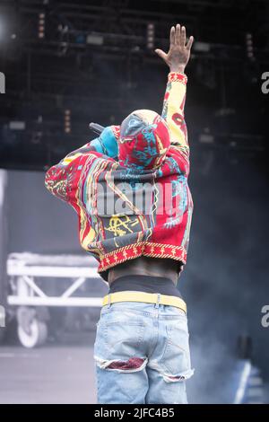 HOLD THE UZI VERTICAL @liluzivert rocks a knit  @seventhheaven sweater at Wireless Festival '22 in London pairing it wit