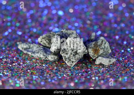 Granites are coarsely crystalline plutonic rocks (plutonites) rich in quartz and feldspar Stock Photo