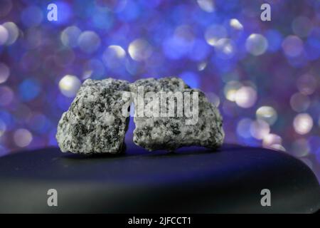 Granites are coarsely crystalline plutonic rocks (plutonites) rich in quartz and feldspar Stock Photo