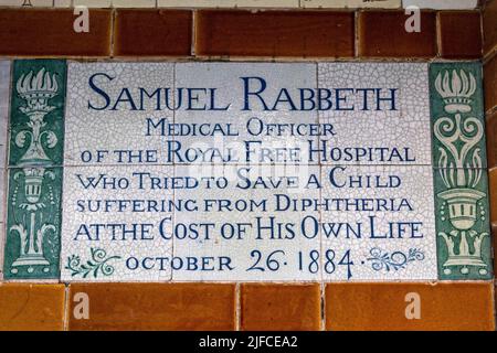 London, UK - June 14th 2022: Plaque at the Memorial to Heroic Self-Sacrifice in Postmans Park in London, UK - commemorating ordinary people who died w Stock Photo