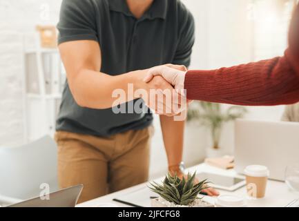 Businesspeople greeting with a handshake. Closeup of architects shaking hands in a meeting.Hands of businesspeople during an interview. Engineers Stock Photo