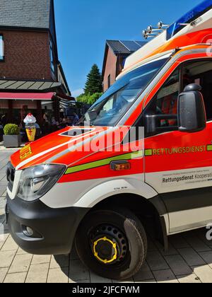 Bordesholm, Germany - 1. July 2022: A German ambulance parked in the center of Bordesholm Stock Photo