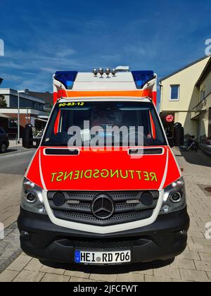 Bordesholm, Germany - 1. July 2022: A German ambulance parked in the center of Bordesholm Stock Photo