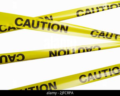 Caution-black fit on yellow plastic bands. White background. Restriction of movement, epidemics, quarantine, objects under construction. There are no Stock Photo