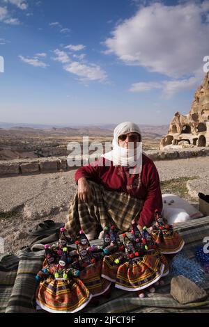 Souvenir vendor selling traditional dolls in Uchisar village, Cappadocia region, Turkey. Stock Photo