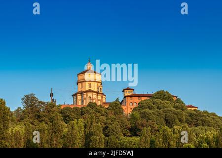 View of Santa Maria del Cappuccini Church on top of a hill surrounded by trees in Po riverbank Turin Italy Stock Photo