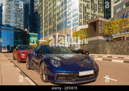 MOSCOW, RUSSIA - October 10, 2021: Cars are parked on the highway under the skyscrapers of the International Business Center Moscow City. Skyscrapers Stock Photo