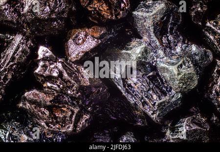 Potassium permanganate crystals under 4x magnification microscope, image width 9mm - abstract science background Stock Photo