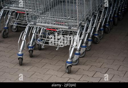 Stacked shopping carts in front of a yellow background, Eckental ...