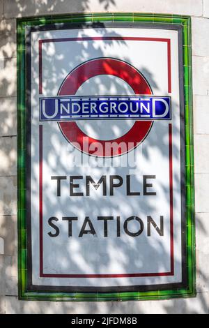 London, UK - April 20th 2022: Vintage sign on the exterior of Temple Underground Station in central London, UK. Stock Photo