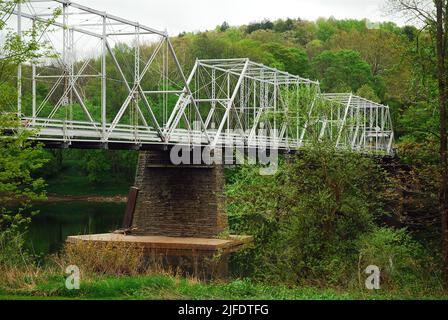 Dingmans Ferry Bridge, a steel truss bridge spans the Delaware River from Pennsylvania and New Jersey, is one of the last privately owned toll bridges Stock Photo