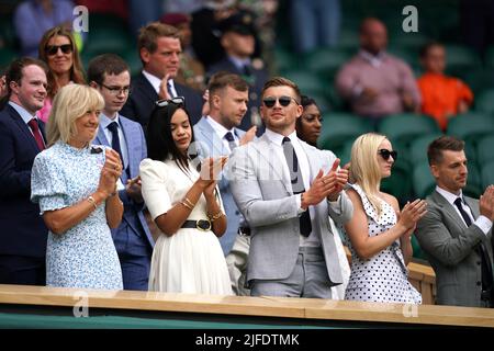 Eirianedd Munro (centre left) and Adam Peaty (centre right) in the Royal Box during day six of the 2022 Wimbledon Championships at the All England Lawn Tennis and Croquet Club, Wimbledon. Picture date: Saturday July 2, 2022. Stock Photo