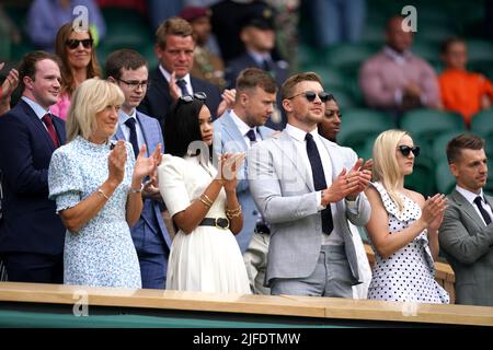 Eirianedd Munro (centre left) and Adam Peaty (centre right) in the Royal Box during day six of the 2022 Wimbledon Championships at the All England Lawn Tennis and Croquet Club, Wimbledon. Picture date: Saturday July 2, 2022. Stock Photo