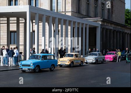 27.05.2022, Berlin, Germany, Europe - Colourful vintage Trabant cars are seen on the street in front of the James Simon Gallery on Museum Island. Stock Photo
