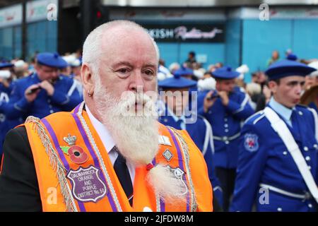 Glasgow, UK. 02nd July, 2022. The County Grand Orange Lodge of Scotland, supported by more than 40 other Lodges and bands had their annual parade through Glasgow city centre, beginning with a religious service at George Square and finishing the parade at Glasgow Green. It was estimated that more than 4000 took part, including all the office bearers and band members. Credit: Findlay/Alamy Live News Stock Photo