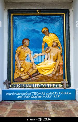 Norfolk, UK - April 7th 2022: Close-up of a religious sculptured plaque at The Shrine of Our Lady of Walsingham in Norfolk, UK, depicting Jesus being Stock Photo