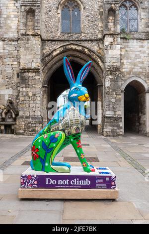 Hares of Hampshire Art Trail in Winchester city centre during summer 2022, England, UK. Colourful hare sculpture in front of Westgate Museum. Stock Photo