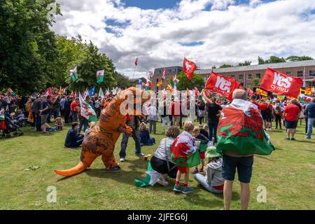 Wrexham, Wales, UK, 2nd July , 2022. Thousands join march for Welsh Independence in Wrexham, North Wales. Police estimate that 6-8 thousand people march through the centre of Wrexham in support of Welsh Independence from the UK. Credit Haydn Denman/Alamy Live News Stock Photo