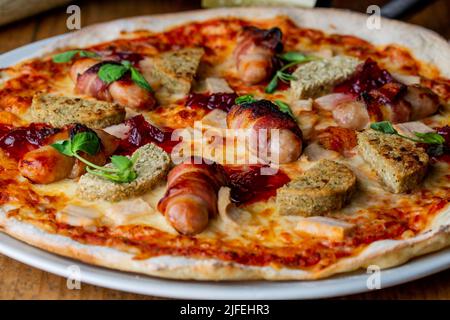 A freshly baked pizza with lots of toppings Stock Photo