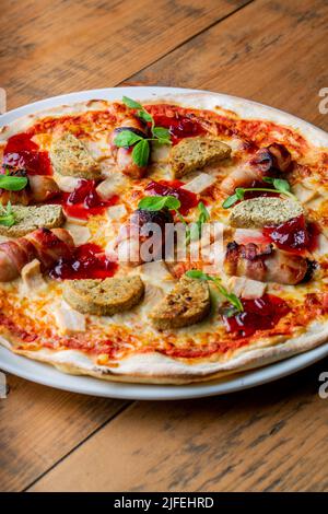 A freshly baked pizza with lots of toppings Stock Photo