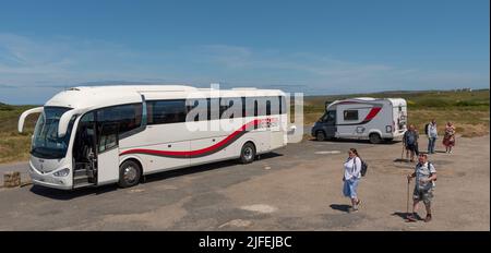 Lands End, Cornwall, England, UK. 2022. Holiday coach and motorhome parked at Lands End on the Cornish coast. UK Stock Photo