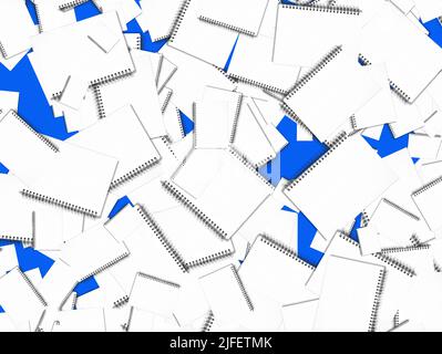 Large group of spiral notebooks scattered on blue background Stock Photo