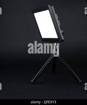 flashlight searchlight for video filming on a black background Stock Photo