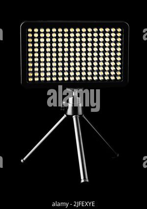 flashlight searchlight for video filming on a black background Stock Photo