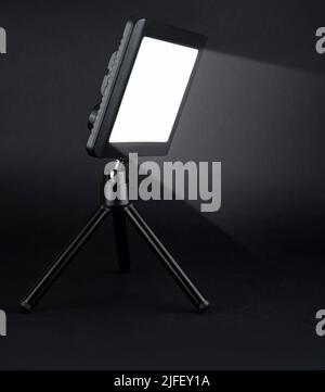 flashlight searchlight for video filming on a black background Stock Photo