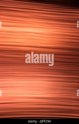 Abstract orange black background made of thin wavy lines and highlights. Vertical back Stock Photo