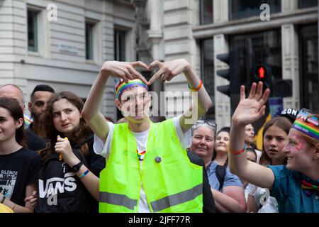 Gay Pride March - Spectators Along March Route  - 2 July 2022,  London, UK Stock Photo