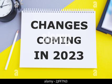 Changes coming in 2023 text write on Notebook, business concept, Top view flat lay Stock Photo