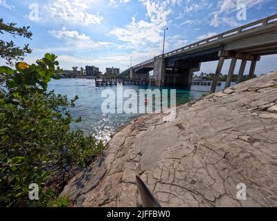 Jupiter, FL USA - June 1, 2022: The area near Catos Bridge drawbridge where people go snorkeling and swimming. Stock Photo
