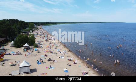 Drone photo of people resting on beach Stock Photo