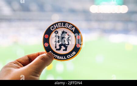 September 12, 2021, London, United Kingdom. The emblem of the Chelsea F.C. football club on the background of a modern stadium. Stock Photo