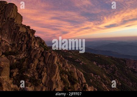 The view form the top of Mount Buffalo, located near Bight in The Victorian High Country. Seeing the sunset from Mount Buffalo is a must. Stock Photo
