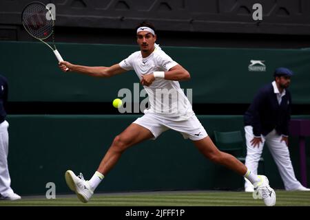 London. Italy's Lorenzo Sonego reaches for forehand during his third round match against number two seed Rafael Nadal of, Spain. 2nd July, 2022. Nadal won the match in straight sets to advance to the fourth round. Credit: Adam Stoltman/Alamy Live News Stock Photo