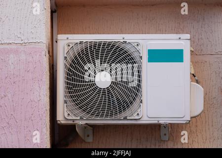air conditioning unit Central split system hanging outside the building Stock Photo