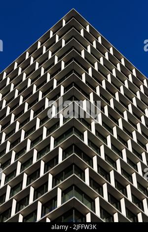 Abstract image looking up at and modern office tower in Tokyo, Japan. Stock Photo