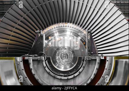 A powerful steam turbine rotor is installed in the lodgment of the steam turbine base. Stock Photo