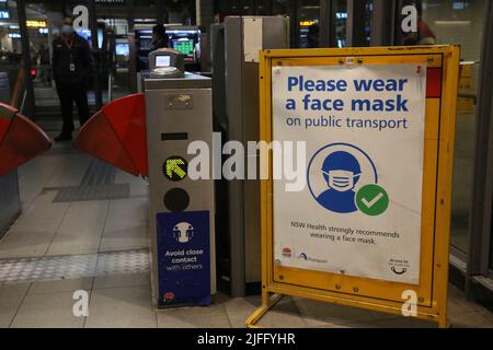 Sydney, Australia. 2nd July 2022. A sign at Town Hall station in Sydney indicates that face masks are only 'strongly recommended', however, they are actually mandatory on public transport and fines apply. However, in practice a significant number of people ignore the mask requirements and the police have not been properly enforcing them. Credit: Richard Milnes/Alamy Live News Stock Photo