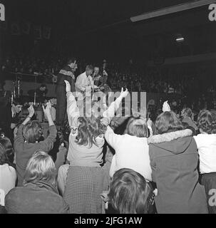 Tommy Steele. English entertainer regarded as Britain's first teen idol and rock and roll star. Born december 17 1936. Picture taken when he performed in Stockholm Sweden April 19 1958. The audience is visibly exited. Stock Photo